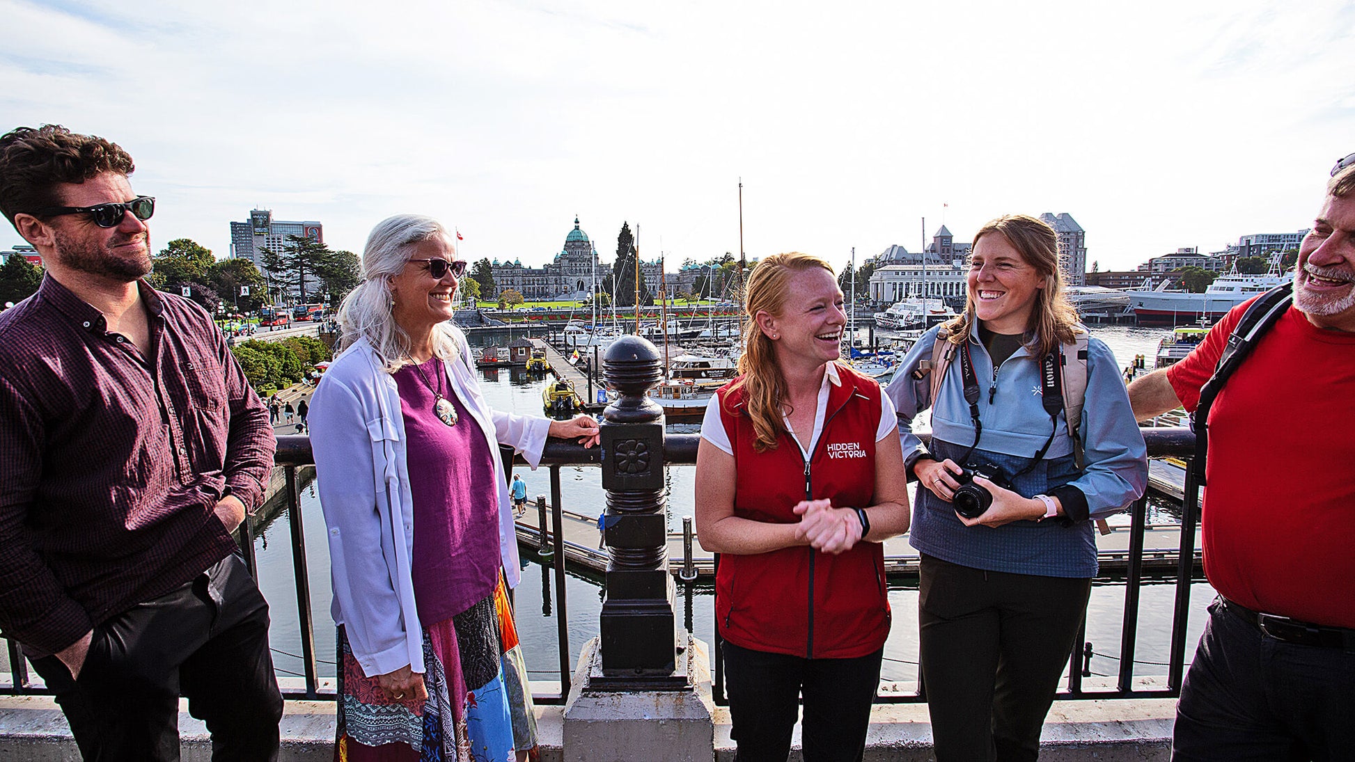 Guided walking tour group at Victoria Inner Harbour with Hidden Victoria