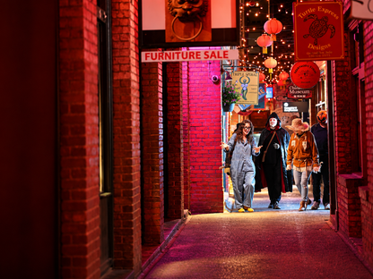 Group having fun listening to ghost stories in Fan Tan Alley